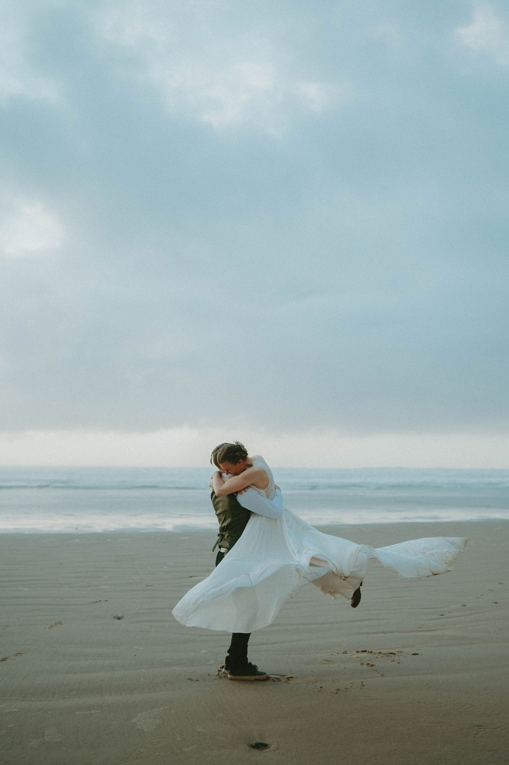 couple dancing at oregon coast during elopement