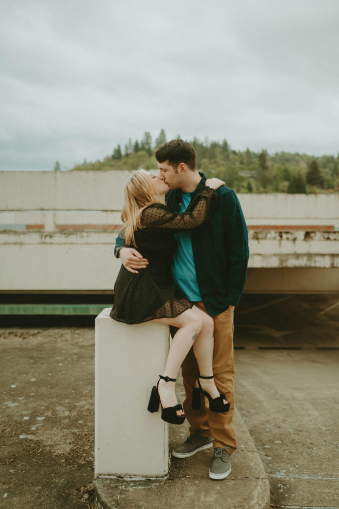 couple on rooftop hugging