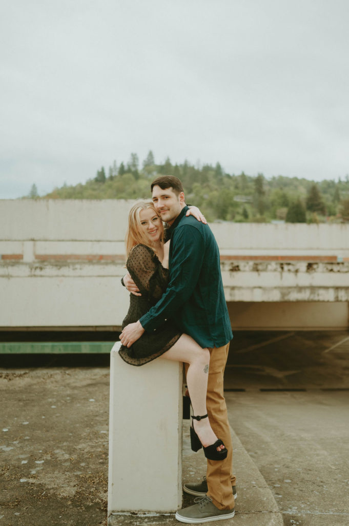 couple on rooftop hugging